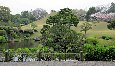 Suizen-ji JÅju-en, a garden in Kumamoto, with an earthen sculpture of Mount Fuji.